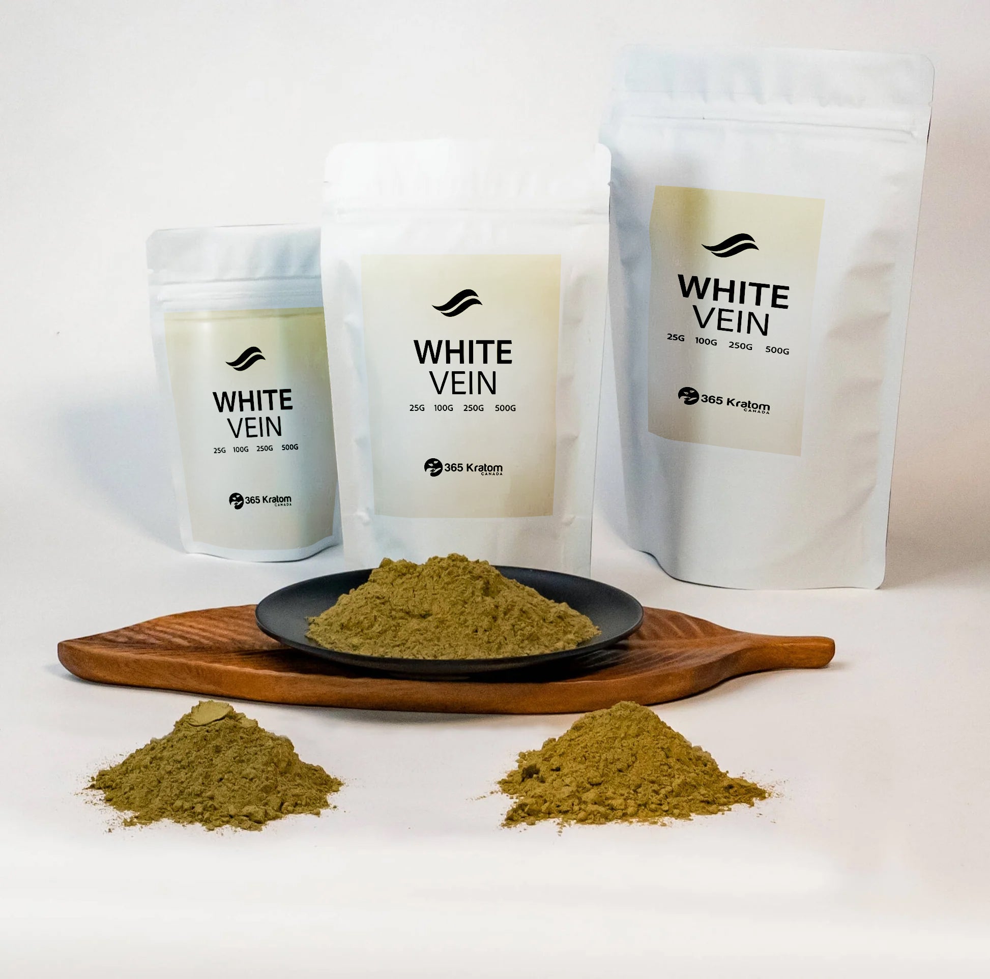 White vein kratom powder and packages displayed on a wooden plate for focus and mental alertness.